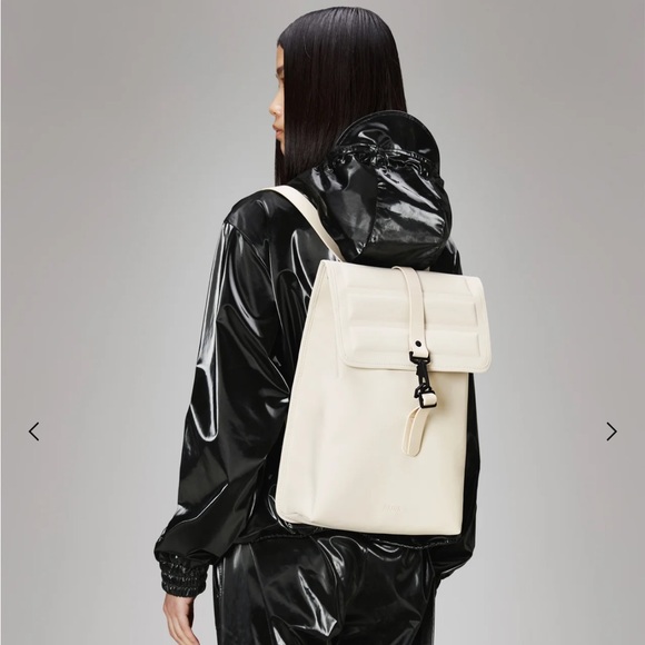 RAINS Shield Rucksack is a clean and functional backpack. Elegant Cream Backpack - Picture 2 of 11